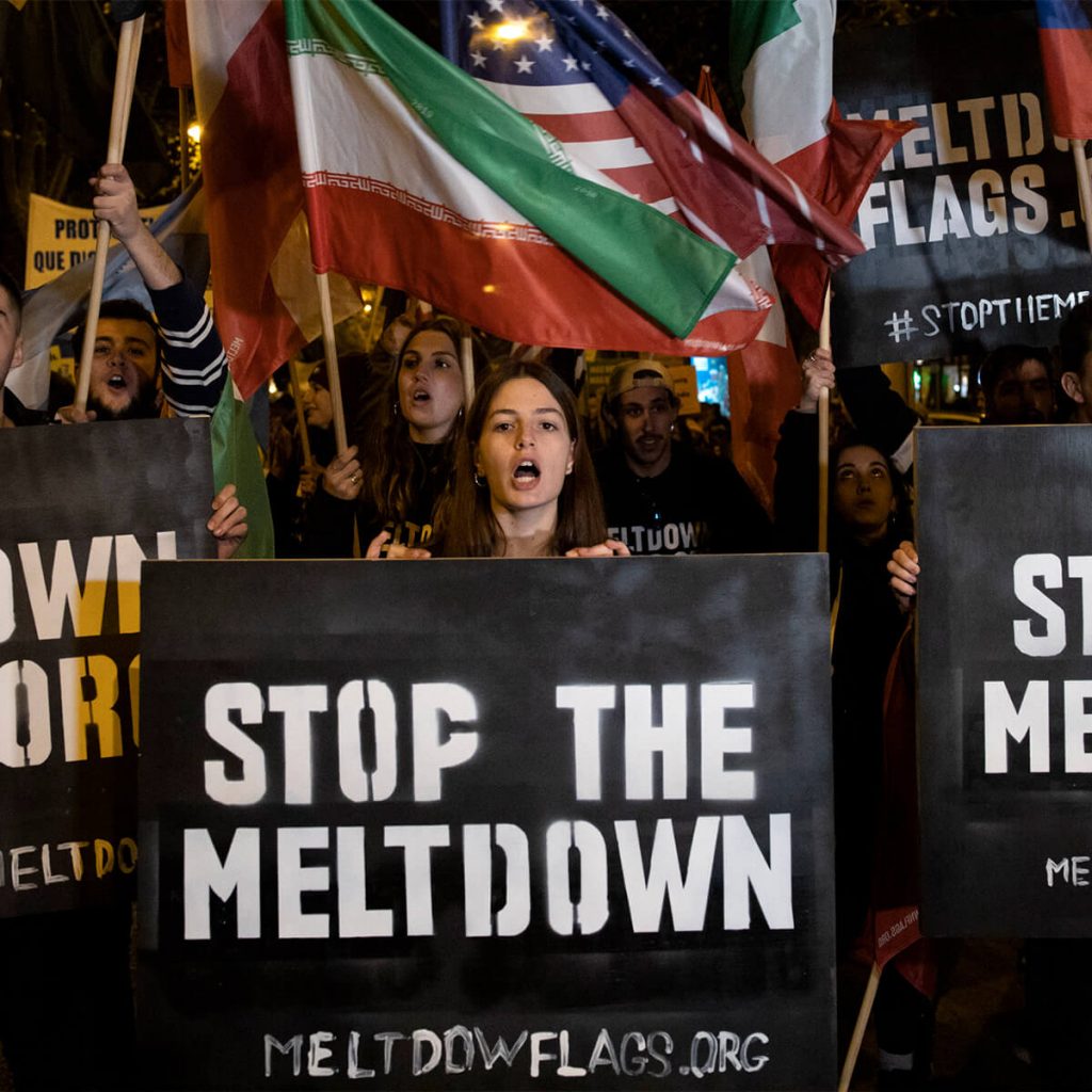 protest pictures, women holding a sign 'stop the meltdown'